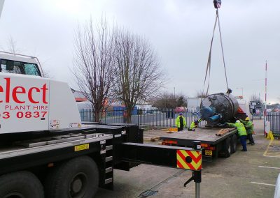 Pic showing the 1st Industrial team loading a Fuji tank onto a lorry