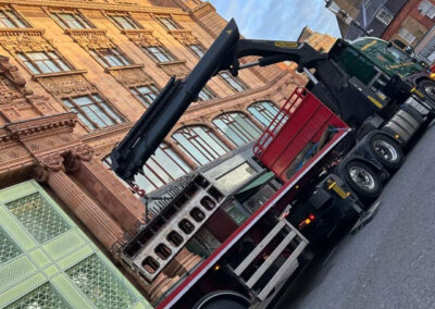 Harrods decommissioned boiler parts being loaded onto a flatbed by the 1st Industrial team